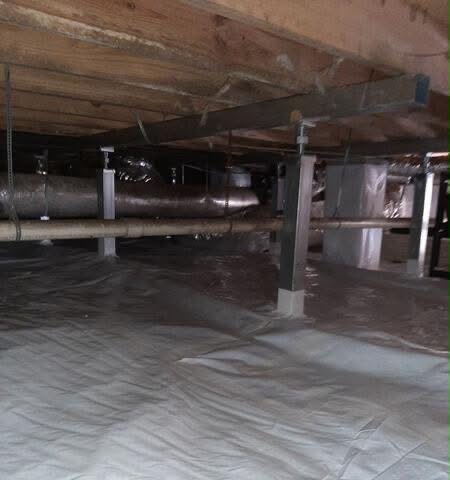 Fully encapsulated crawl space with bright white reinforced vapor barrier, HVAC ducts and structural supports